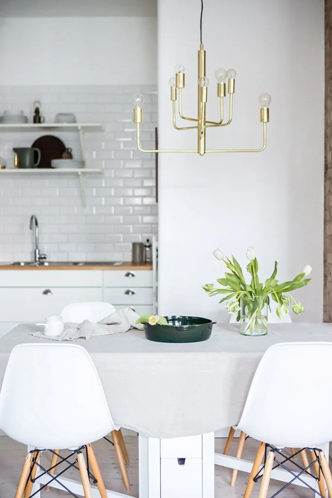 Little dining table in white kitchen