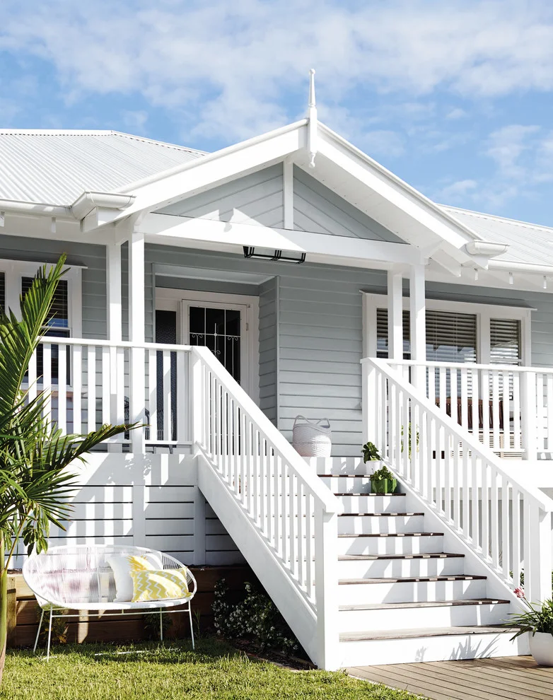 beach style exterior design with white staircase