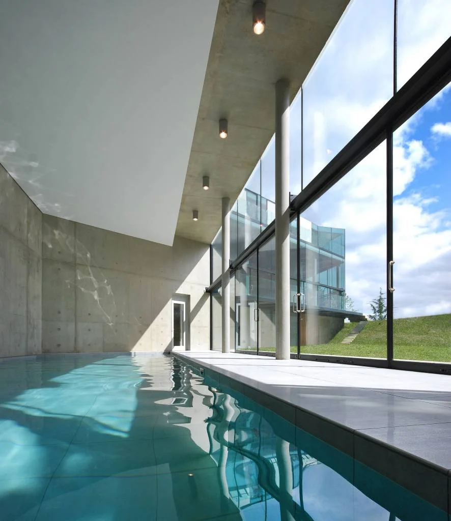 Massive Glass Windows with Sunlight in Pool