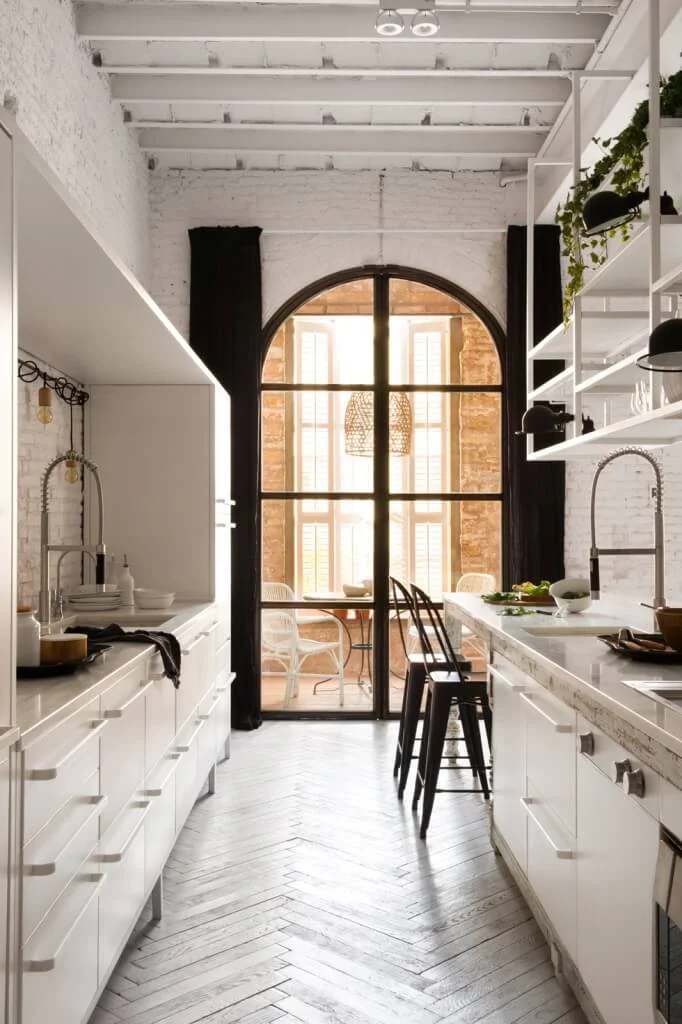 kitchen counter open shelves arched door