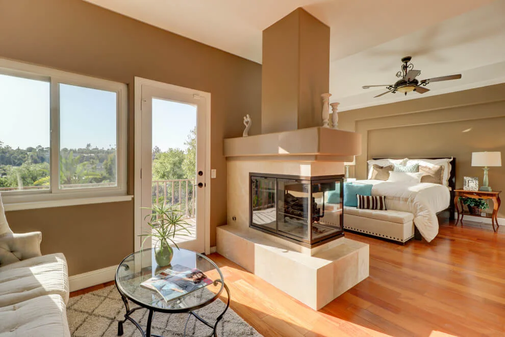 Mediterranean Bedroom With Two-sided Fireplace