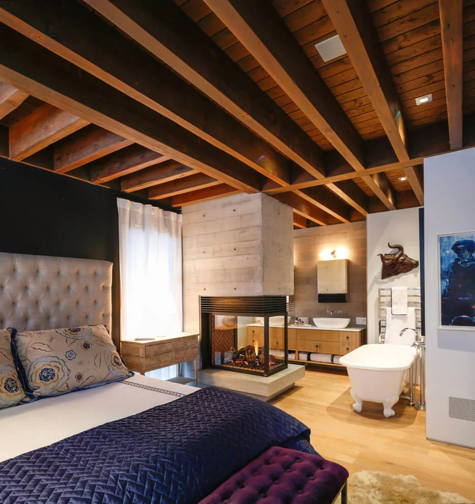 Rustic Bedroom with Two-sided Fireplace