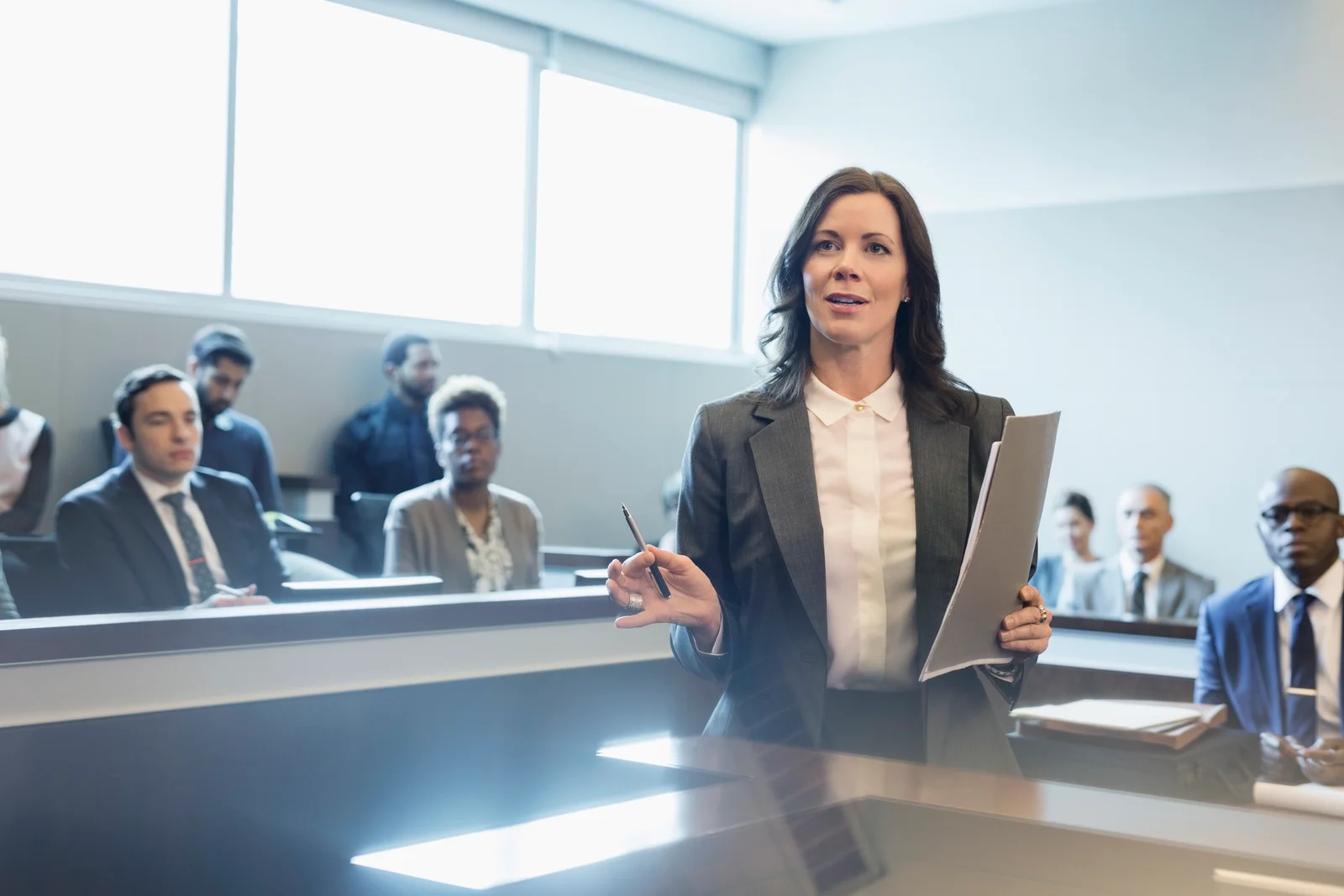 Female attorney talking in legal trial courtroom