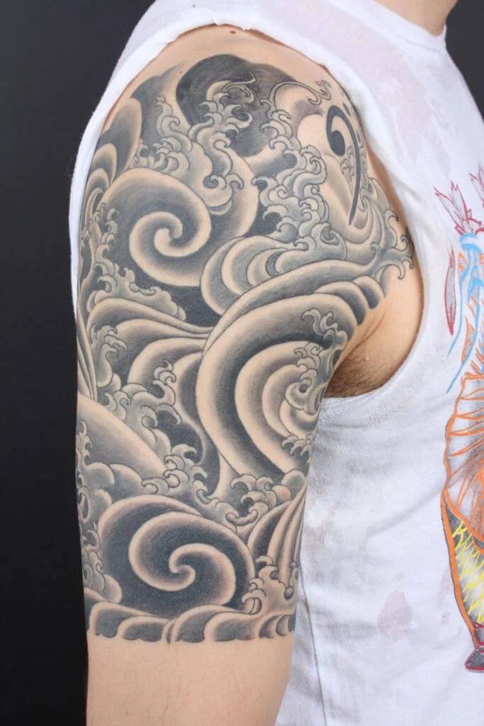 Stunning Half Sleeve Wave Tattoo