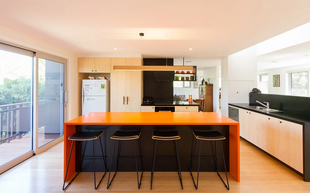 Orange Waterfall Island In Kitchen