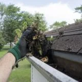 Cleaning Gutters Filled With Leaves & Sticks