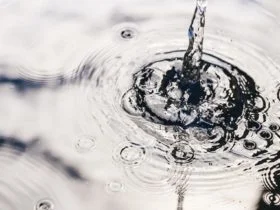 Rainwater harvesting in a large polymer tank on the terrace of a house. Ripples on the surface of water. Aquaphobia – fear of water.