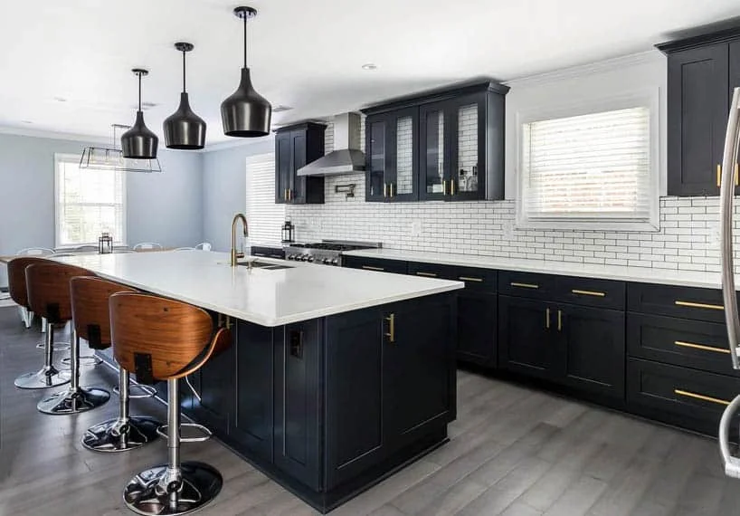 kitchen-with-black-cabinets-white-quartz-countertop-wood-style-porcelain-tile-floor
